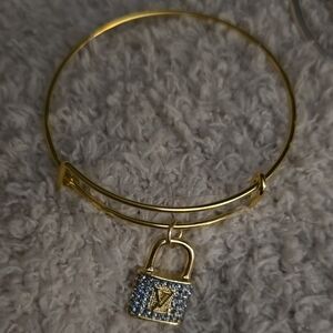 Gold-Tone Padlock Charm Bangle Bracelet with Blue Crystal Accent Lv